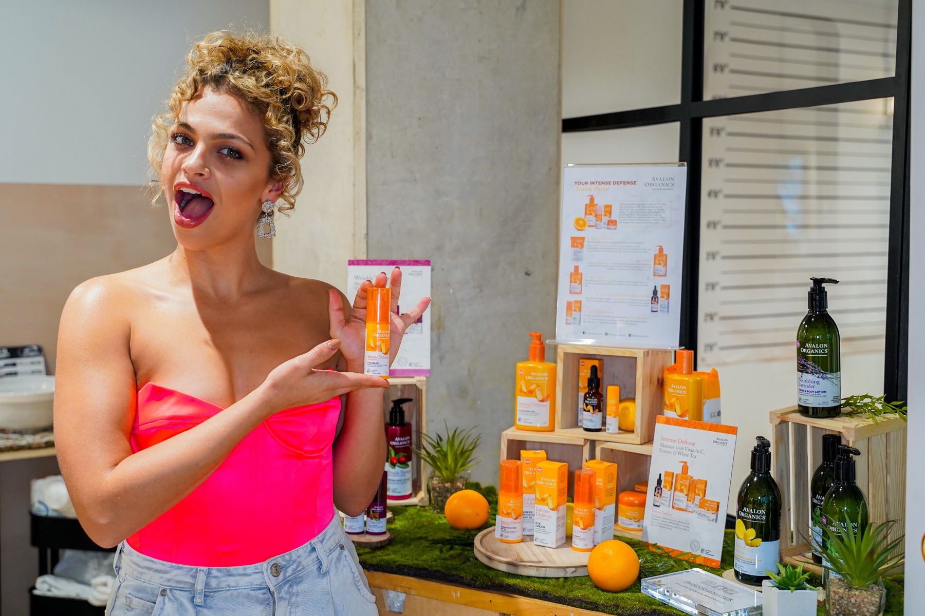 Skincare brand representative presenting a product display