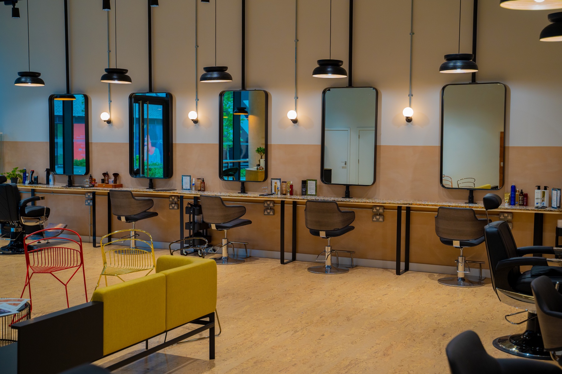 Commercial workspace showing mirrors, lighting and seating layout